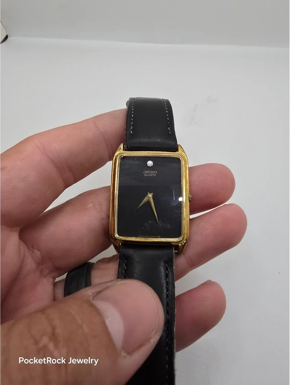 Seiko Quartz Rectangle Gold Tone Case Black Dial Black Leather Strap Watch